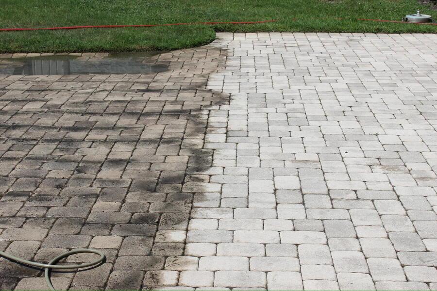 Brick paver driveway after low-pressure cleaning, joint sand left intact, Windermere FL